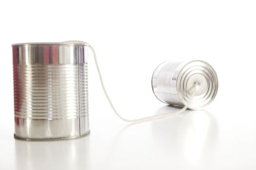 isolated tin or can telephone showing communication