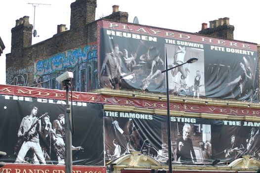 Camden Lock building before the big fire, featuring enormous advertisements of rock and roll
