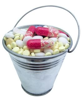 The metallic bucket full of tablet