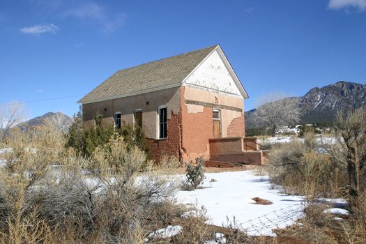Historic adobe schoolhouse once used to education children of pioneers in rural Colorado