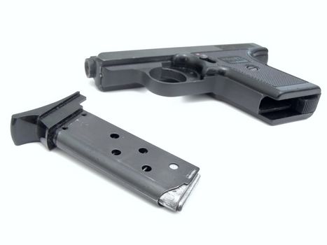 Military gun with charger against the white background