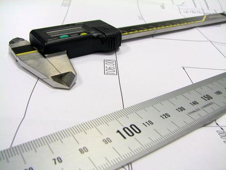 engineer elements ruler and caliper on the draft
