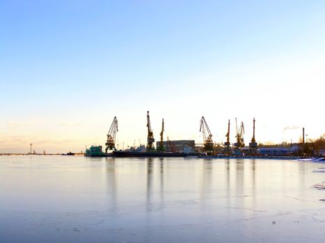 winter cargo side port with ships and cranes