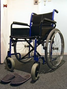Single wheelchair with the sneakers in the hospital