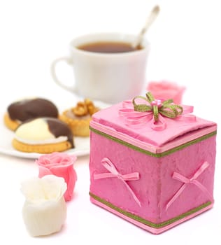 pink small box with surprise, cake and cup with tea for romantic at supper on white background