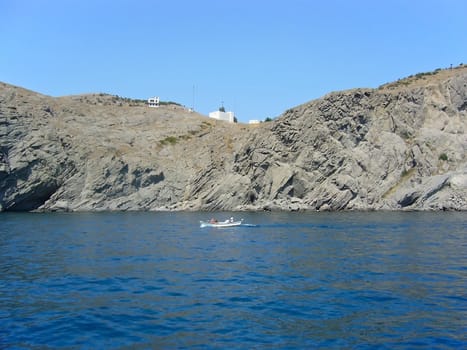 Summer sunny landscape with sea and rock
