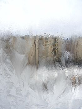 Winter frost window with the ornate crystals