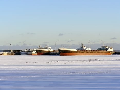 Many ships in ice of the frozen winter sea