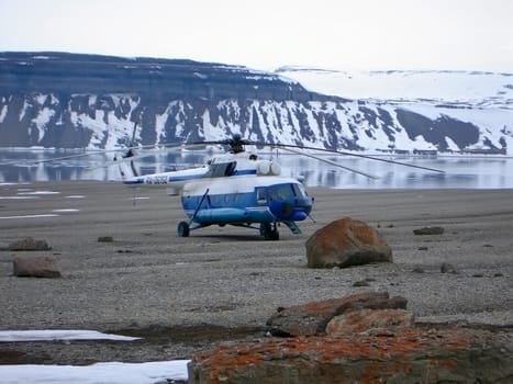 aircraft at the rest near small lake in mountains