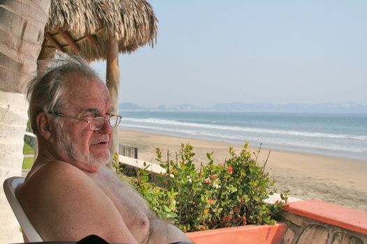 Elderly man enjoying retirement on the beach