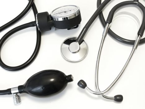 The medical manometer with stethoscope against white background