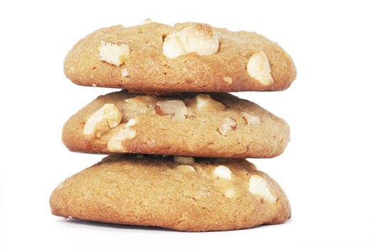 Three  Cookie Biscuits With White Chocolate And Macadamia Nuts, Plain Background