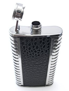 metallic open flask with alcohol against the white bacground