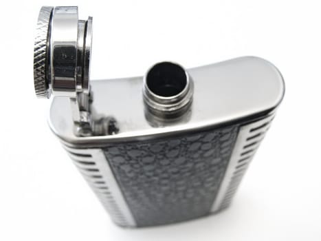 metallic open flask against the white bacground