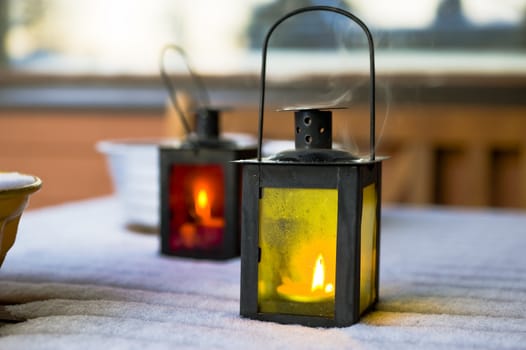 Two candle lanterns inthe winter time taken as macro 