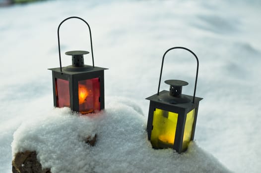Two candle lanterns in the winter time taken as macro 