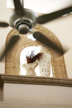 modern window arches with spinning fan