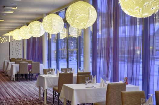 Empty dinner table in luxury hotel restaurant