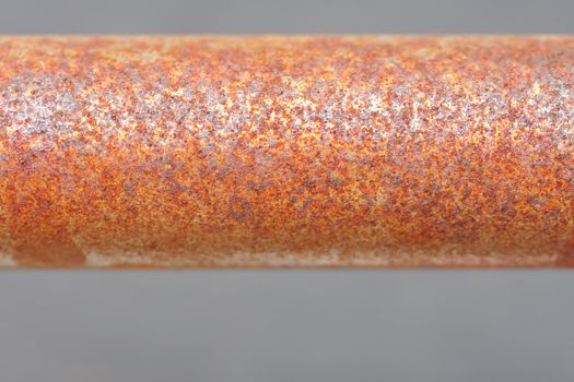 Metal rusty pipe on gray background