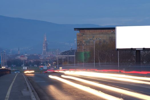 Long exposure of street in Zagreb with empty billboard