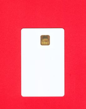 Empty white credit card on red background
