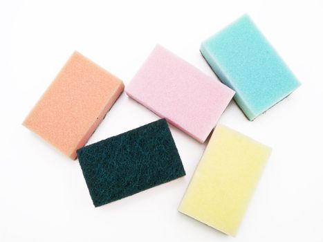 Five multicolored sponges against the white background
