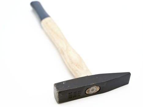 Single hammer with wooden handle against the white background