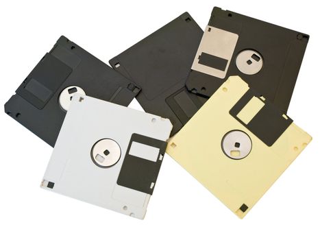 Some isolated multicolored floppies discs at the white table