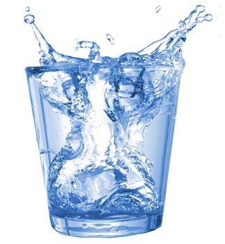 glass of ice water with bubbles on white background