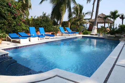 Luxury tropical pool overlooking ocean