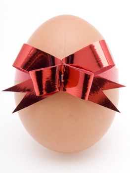 Easter Egg with red bow on white background