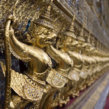 The Grand Palace. Temple of the Emerald Buddha. Gold ornamental patter statuettes