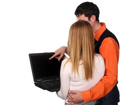 couple working with laptop, pretty blonde and handsome young dark haired man