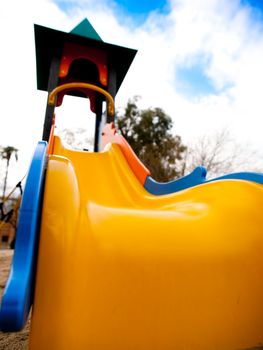 A slide in a park without people