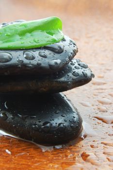 zen stones and leaves showing a wellness or bath concept