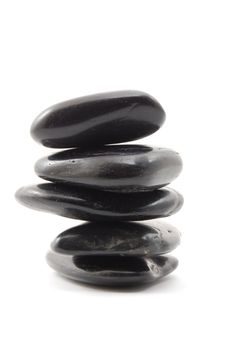 black stones in balance isolated on white background