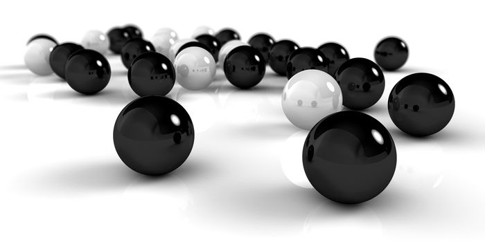A set of black and white balls as concept for teamwork, isolated on white background