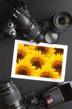 camera and lense on black showing photographer still life