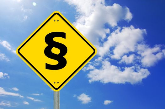 law concept with paragraph on a yellow traffic sign