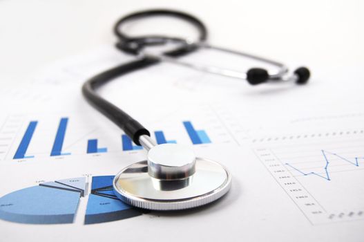 stethoscope on medical data chart in hospital