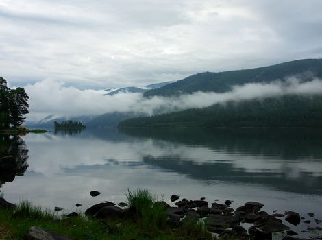 Island on lake in mountains