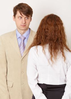 Young pair on a light background - the husband and the wife