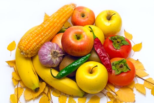 Autumn still-life with vegetables, fruit and yellow leaves