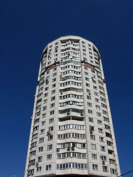 High strong apartment house in Moscow on a background of blue sky