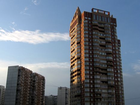 High strong new house on a background of old building