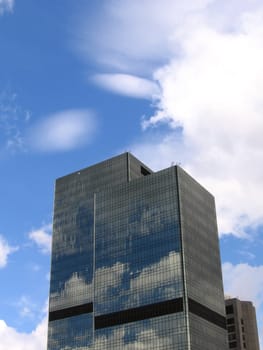 Two Moscow towers at sunny day on a background of beautiful clouds