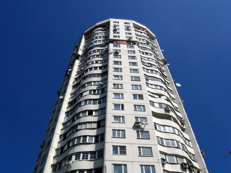 High strong apartment house in Moscow on a background of blue sky
