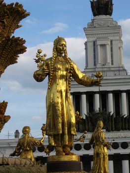 Gold women statue of the fountain at VDNH in Moscow