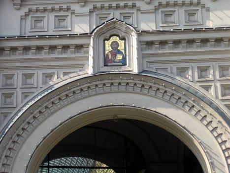 Arch with orthodox on the building in Moscow center