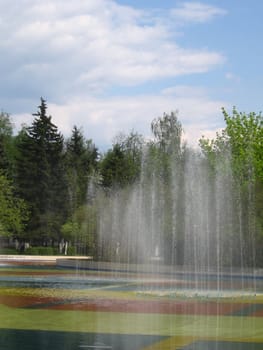 Very beautiful fountains at the Moscow park on a background of blue sky with clouds